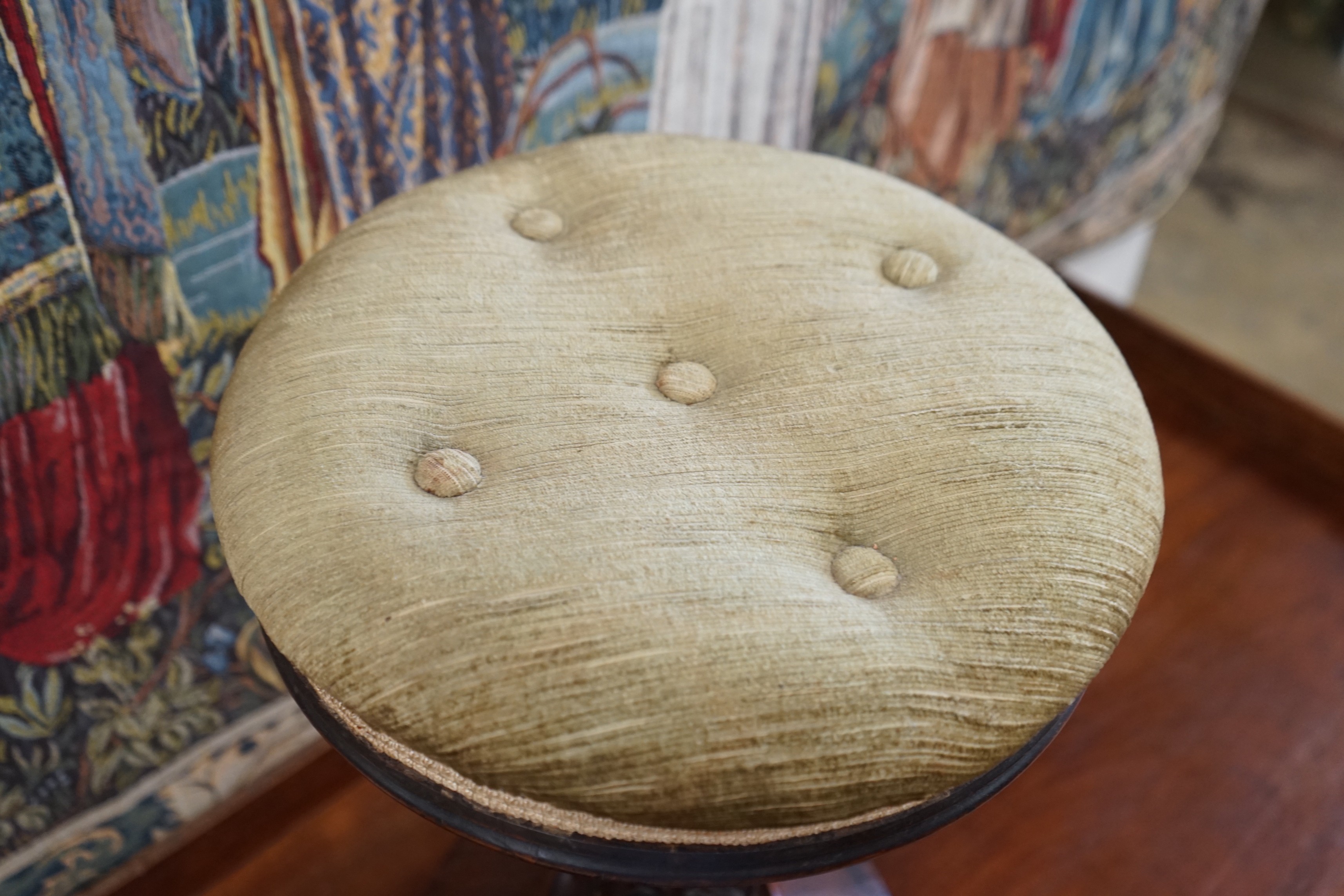 An early Victorian rosewood circular piano stool, height 49cm